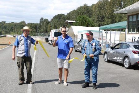Kirk McLean cuts the ribbon to officially open the 2016 BCHMR. Canadian Motorsport Hall of Famer Bill Sadler (L) and BC road racing legend All Ores (R) 'pick up the pieces! - Brent Martin photo